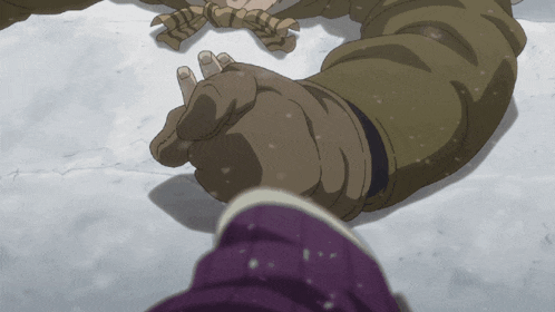 a person is laying in the snow holding someone 's hand