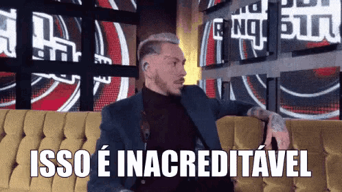 a man in a suit is sitting on a couch with the words isso e inacreditavel written on the bottom