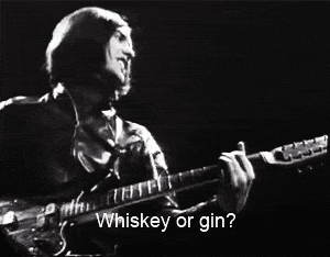 a man singing and playing a guitar with the words whiskey or gin written below him