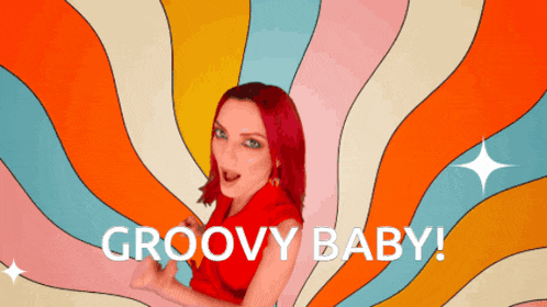 a woman with red hair says groovy baby in front of a psychedelic background