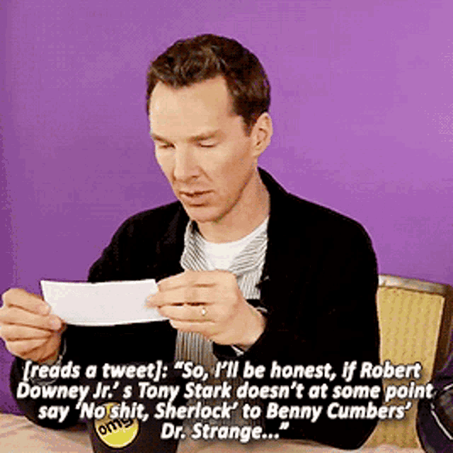a man holding a piece of paper that says " reads a tweet "