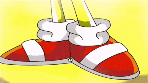 a pair of red and white sonic the hedgehog shoes with a yellow background