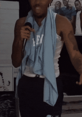 a man with a towel around his neck and a shirt that says afu on it