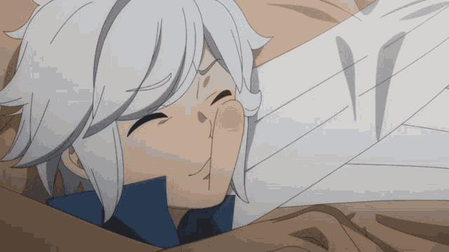 a boy with white hair is laying on a bed