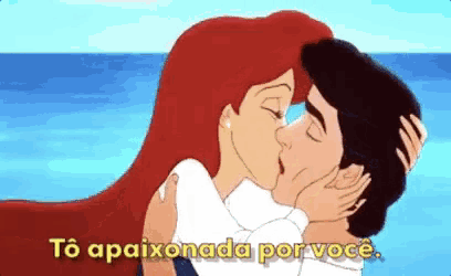 a cartoon of a man and a woman kissing with the words to apaixonada por voce written below them