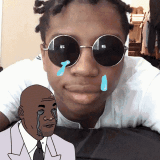 a man wearing sunglasses and a drawing of a man crying behind him