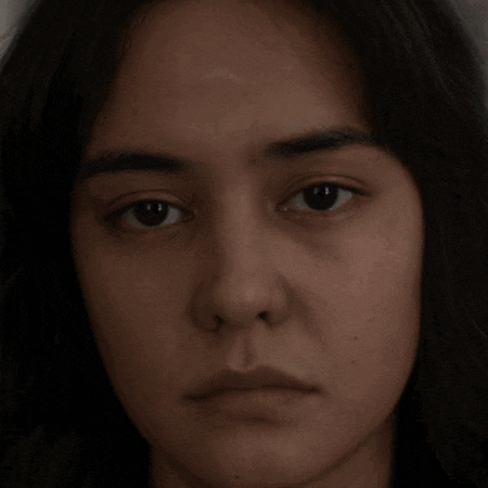 a close up of a woman 's face shows her eyes and nose