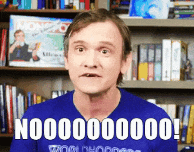 a man is wearing a blue shirt that says world dodgeball on it