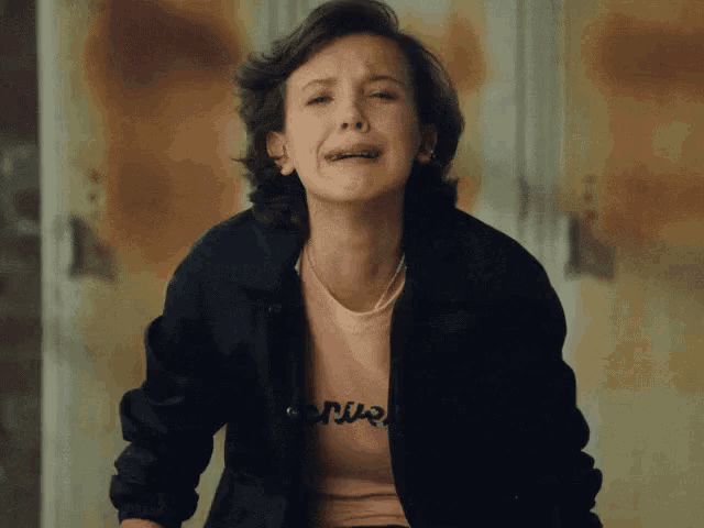 a woman wearing a pink shirt with the word venus on it