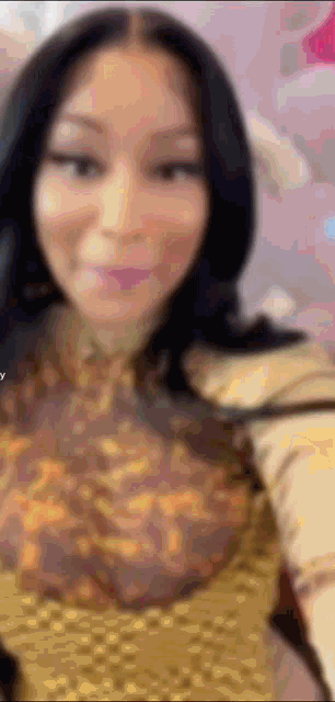 a close up of a woman 's face with a blurred background