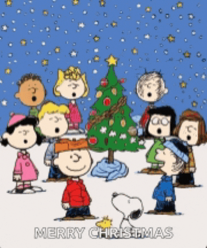 a group of peanuts characters singing christmas carols in front of a christmas tree