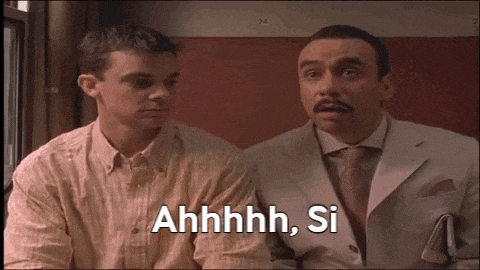 two men are sitting next to each other and one of them is saying " ahhhh , si "