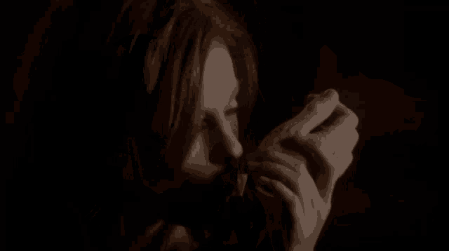 a close up of a woman with her mouth open