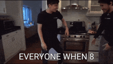 two men dancing in a kitchen with the words everyone when 8 below them