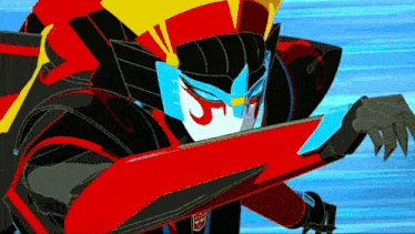 a cartoon character with a red and black costume is holding a red object in his hand