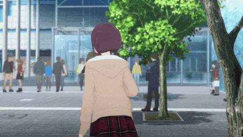 a girl in a plaid skirt is walking in front of a building