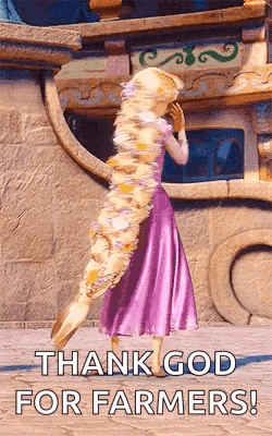 rapunzel from tangled is standing in front of a building with a long hair .