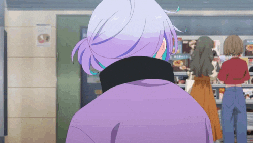 a woman with purple hair and a purple jacket is standing in front of a store .