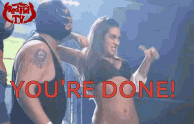 a woman in a black bra is standing next to a man in a mask and the words you 're done