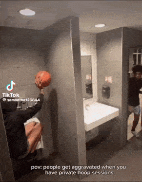 a person holding a basketball in a bathroom with a caption that says pov people get aggravated when you have private hoop