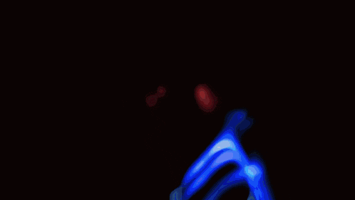 a close up of a person 's face with red eyes and a blue background