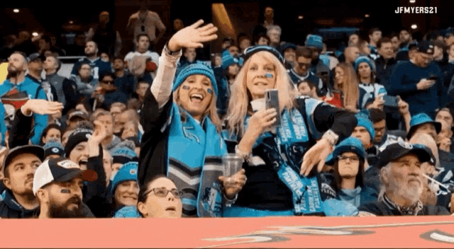 a crowd of people in a stadium with jfmyers21 on the bottom