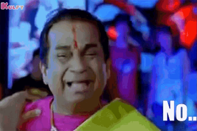 a man is making a funny face and the word no is on the screen