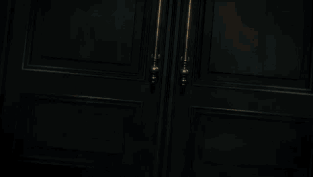 a person is flying through a door with flames behind them