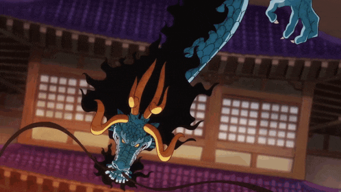 a blue and black dragon with horns is flying in the air