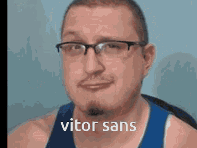 a man wearing glasses and a blue tank top has the word vitor sans written on his face .