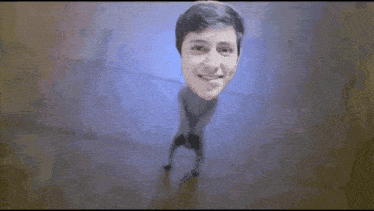 a man with his head sticking out of a hole in the wall