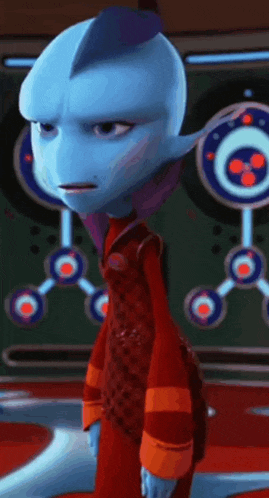 a cartoon character with a blue head and purple ears is standing in front of a green wall .