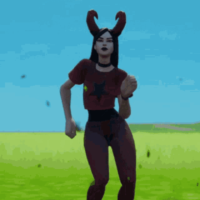 a woman with horns on her head is dancing in the grass