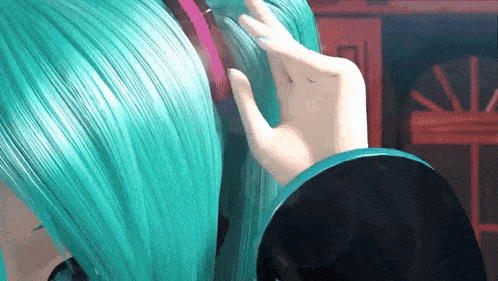 a close up of a person 's hair with a pink ribbon