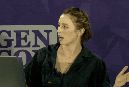a woman in front of a sign that says gen on it