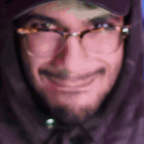 a close up of a person wearing glasses and a hat