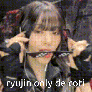 a woman is holding a sword in her mouth and says `` ryujin only de coti '' .