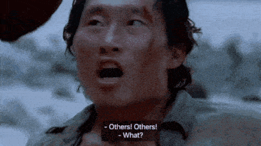 a close up of a man 's face with a caption that says others others what ..