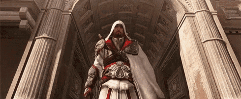 a man in a white cape stands in front of a building with columns