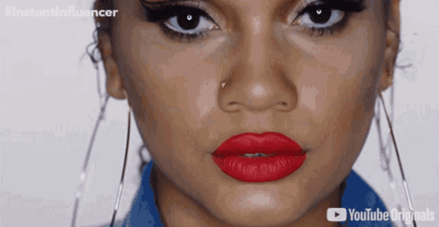 a close up of a woman 's face with red lips and a youtube originals logo in the corner