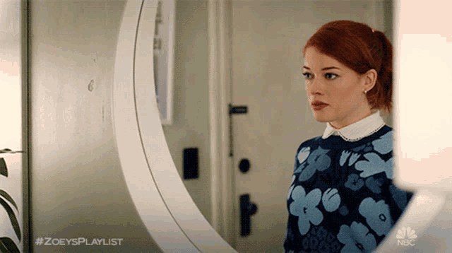 a woman standing in front of a mirror with #zoeysplaylist on the bottom