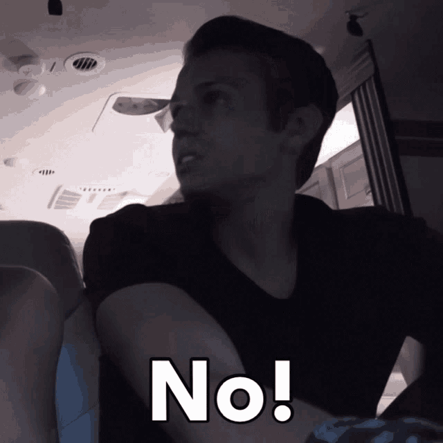 a man in a black shirt says " no "