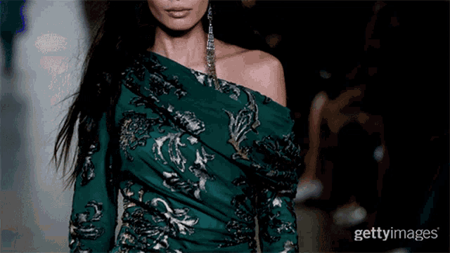 a model walks the runway at a fashion show during fashion week