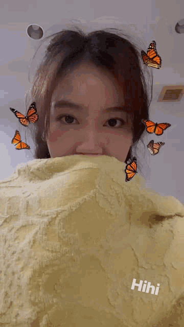 a woman is surrounded by butterflies and the word hihi is on the bottom