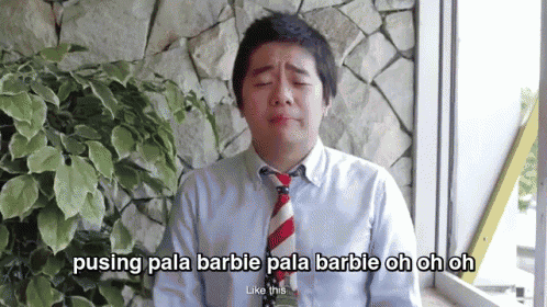 a man in a blue shirt and red white and blue tie is crying and says pusing pala barbie pala barbie oh oh oh