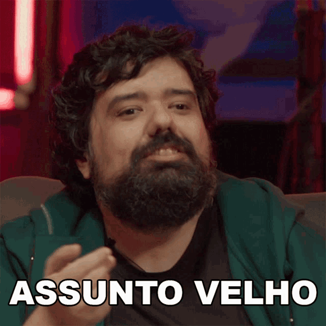 a man with a beard has the word assunto velho written on his chest