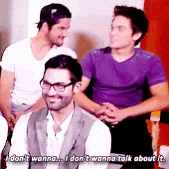 a man in a purple shirt says " i don t wanna talk about it "