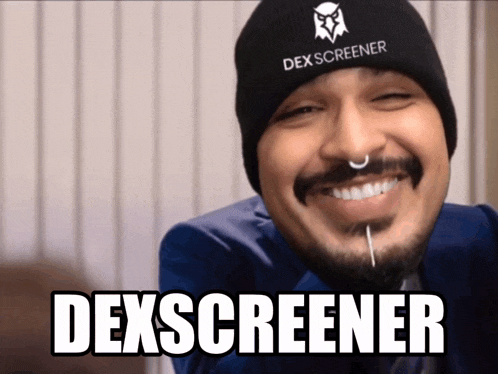 a man wearing a beanie that says dexscreener
