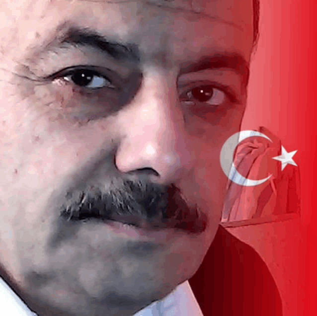a man with a mustache has a crescent moon and star on his face