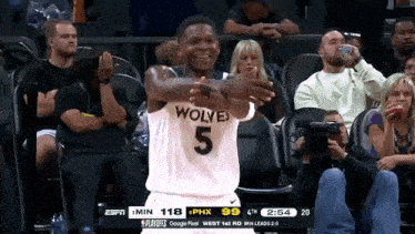 a basketball player with the number 5 on his jersey is dancing